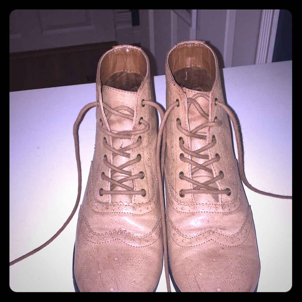 Tan lace up booties.